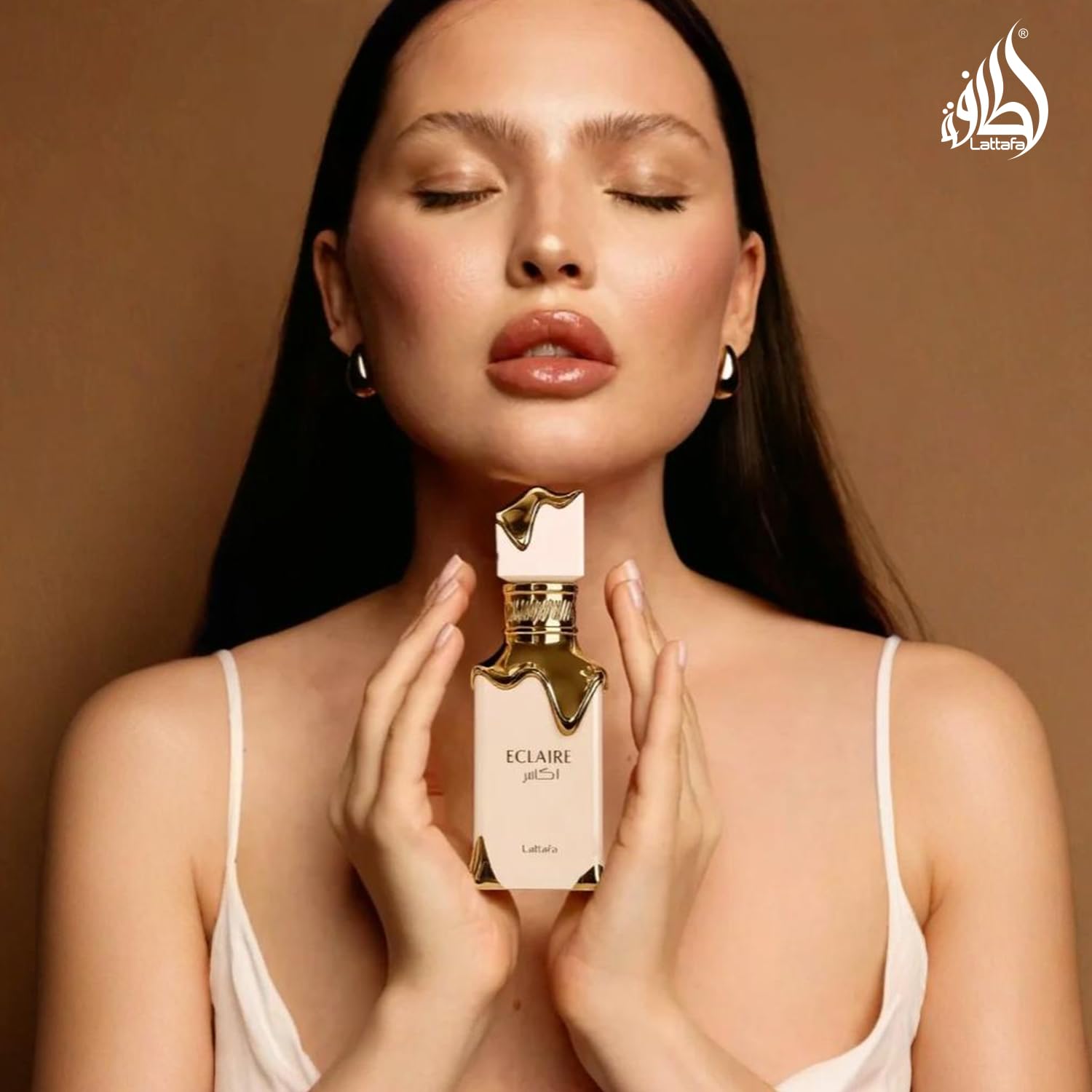 Lattafa Eclaire packaging box emphasizes premium fragrance.