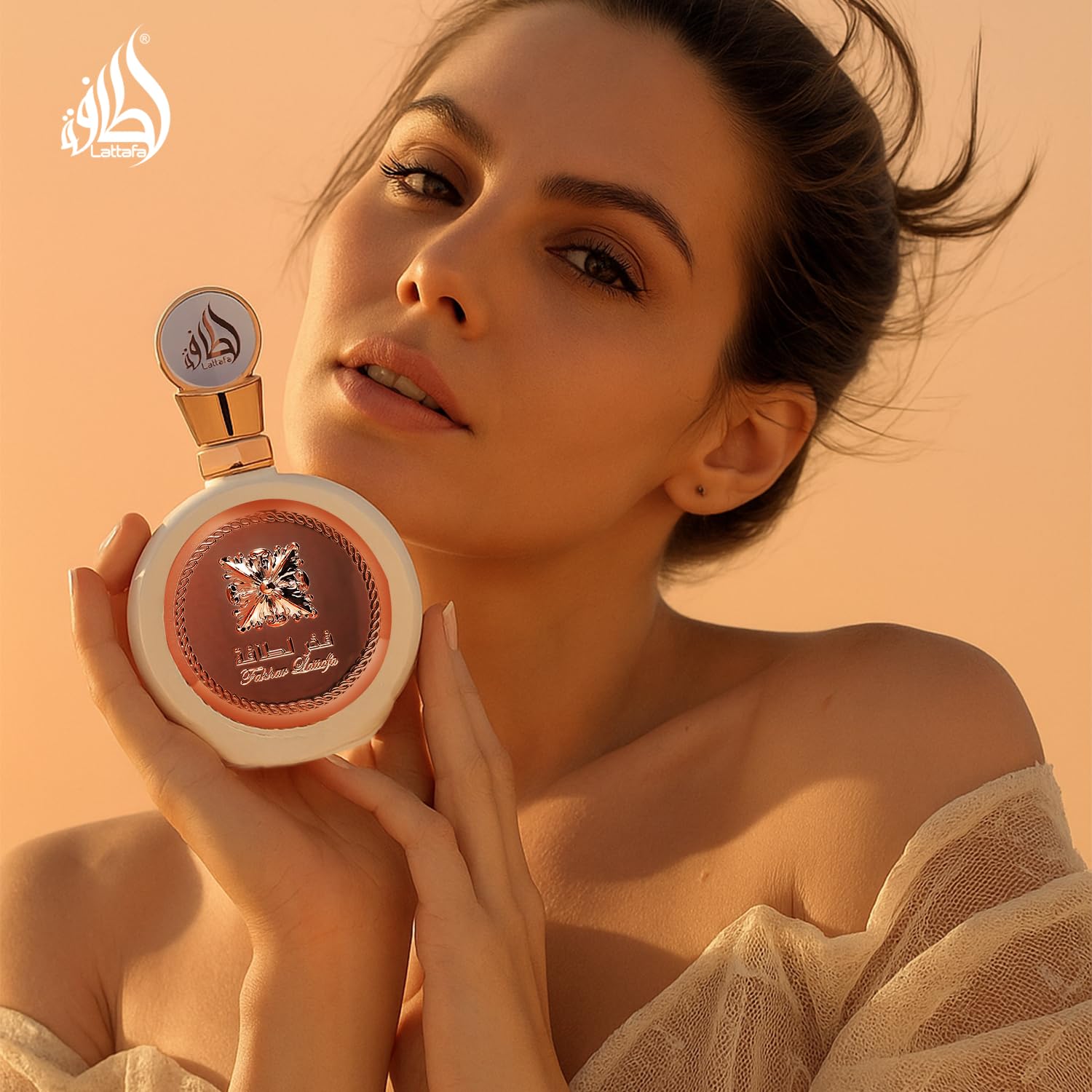 Lattafa Fakhar perfume detail highlights notes and elegant glasswork.