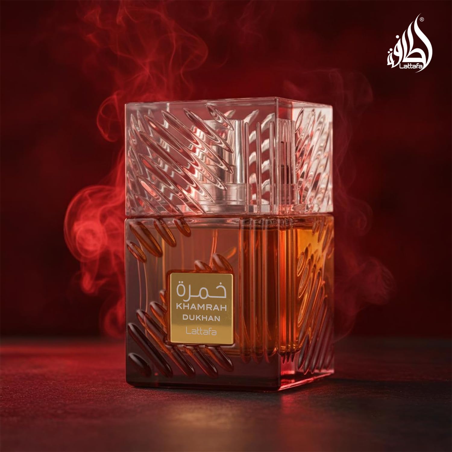 Lattafa Khamrah Dukhan amber-hued bottle suggests rich gourmand character.