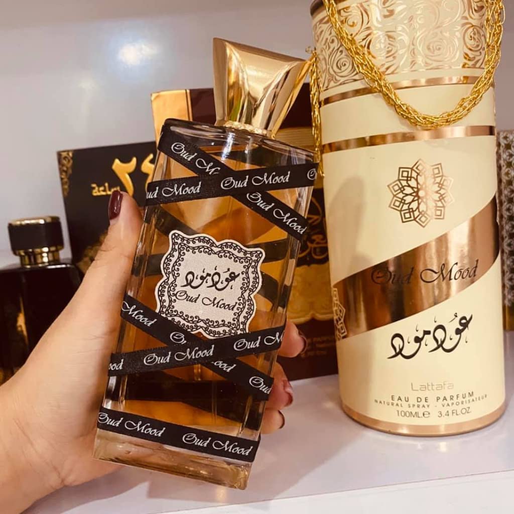 Lattafa Oud Mood amber-resins heart, adds warm depth.