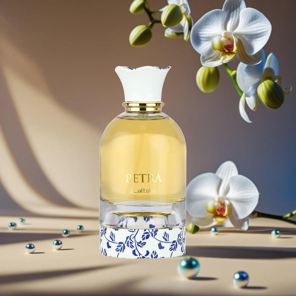Open box reveals Petra EDP bottle on wooden surface