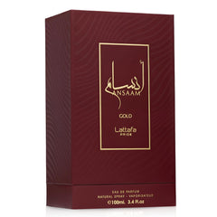 Lattafa Pride Ansaam Gold bottle in light showcases radiant gold tone.