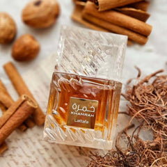 Lattafa Qahwa bottle with coffee and caramel for rich comfort.