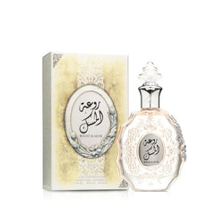 Blue and gold packaging close-up, premium unisex scent presentation.