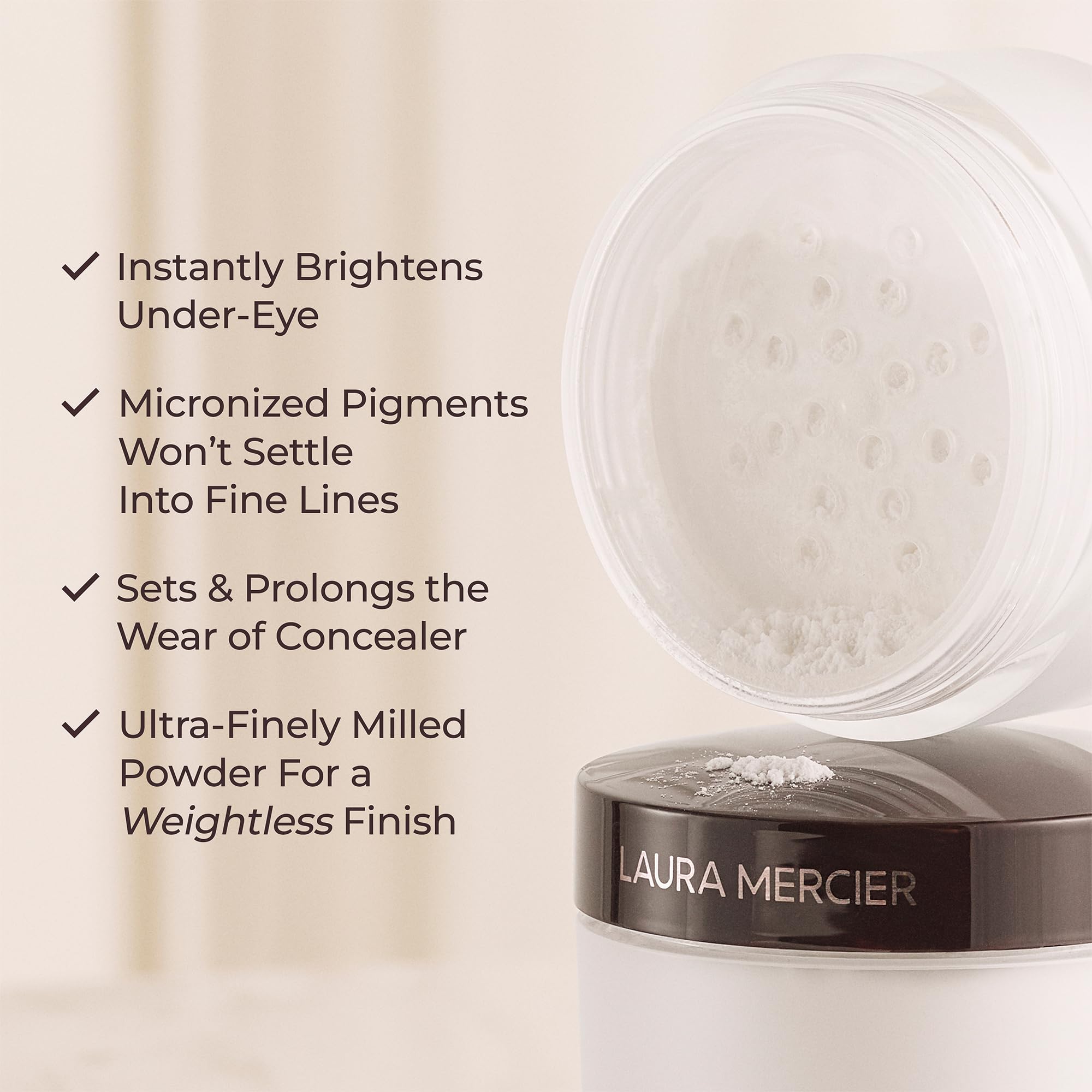 Laura Mercier powder brush application under-eye, soft light-diffusing finish