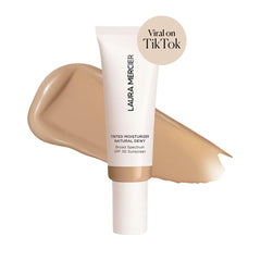 Laura Mercier Tinted Moisturizer Natural Dewy Sand packaging highlights SPF 30 protection and lightweight feel.