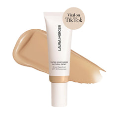 Texture close-up of Laura Mercier Tinted Moisturizer Natural Dewy SPF 30 for breathable wear