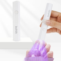 Lavinda handheld UV light cures base coats quickly for home manicures.