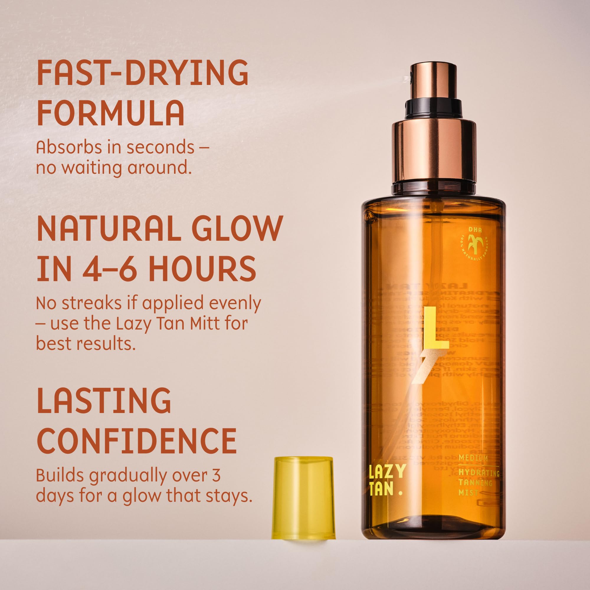 Lazy Tan Face Tan Mist being sprayed evenly with mitt.