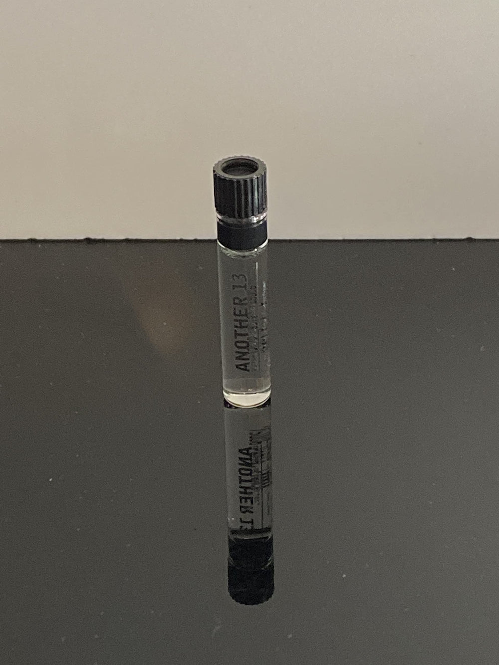 Le Labo Another 13 glass vial highlights subtle notes and a clean, precise dispensing.