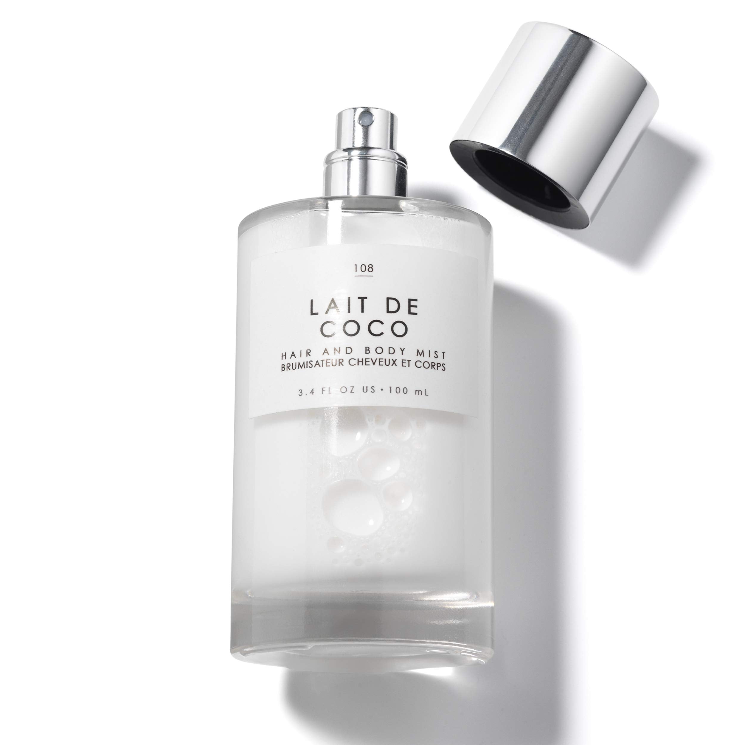 Le Monde Gourmand Lait de Coco mist is applied to hair.