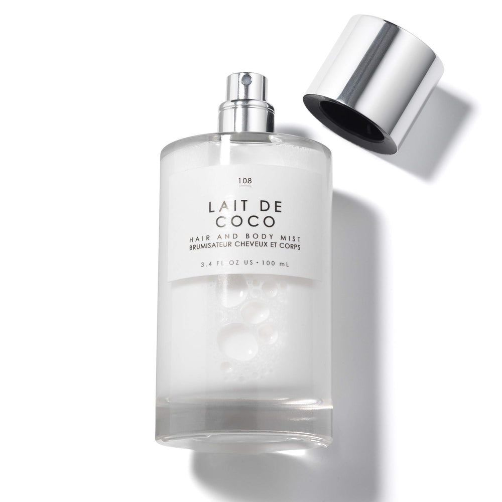 Le Monde Gourmand Lait de Coco mist is applied to hair.