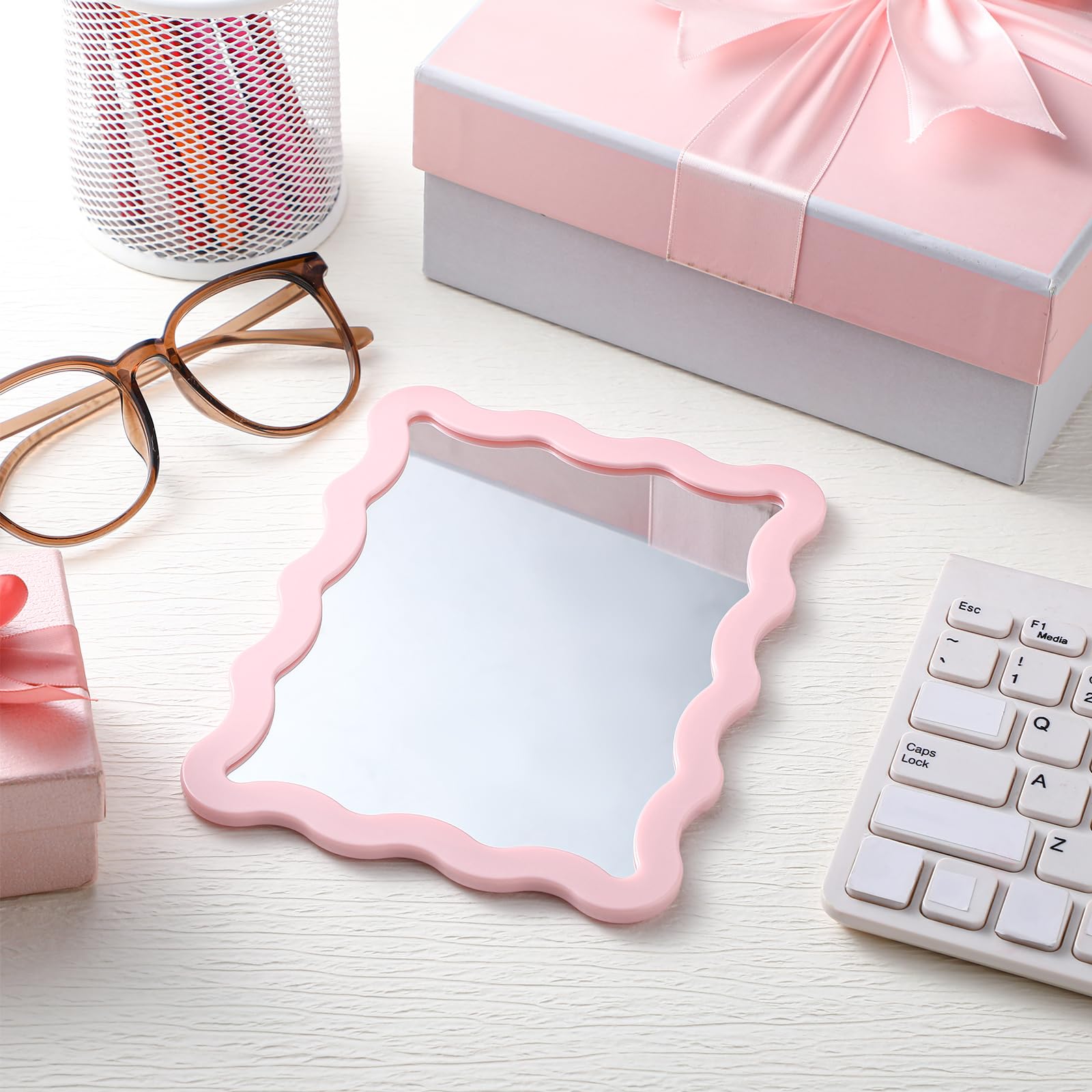 Cute pink scalloped edge complements office or dorm decor while reflecting clearly.