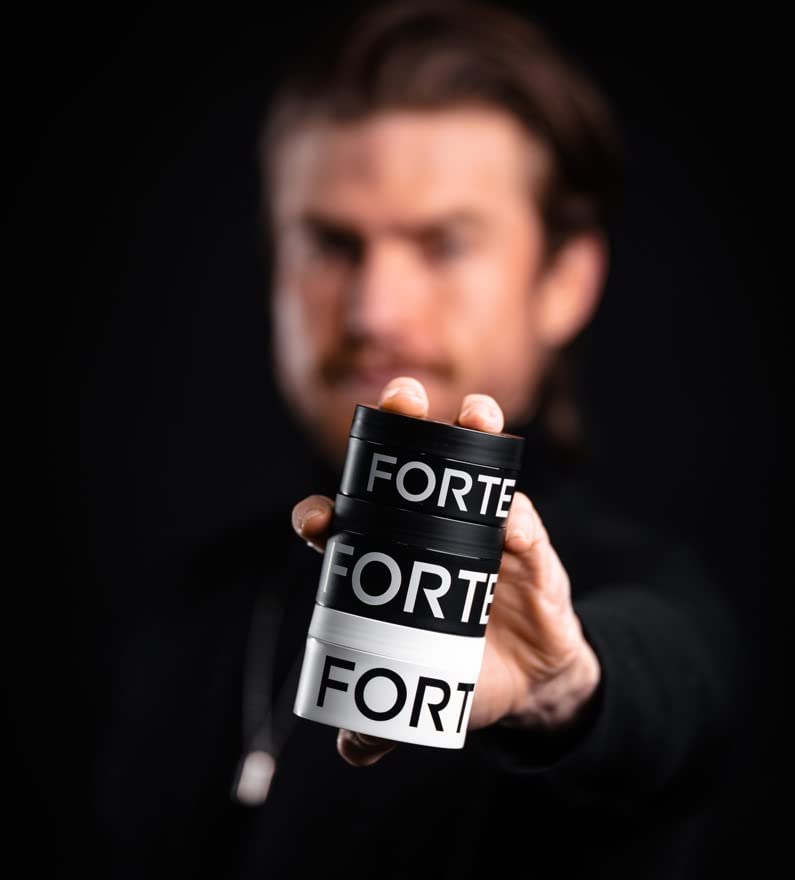 Lifestyle shot shows a man styling with molding paste.