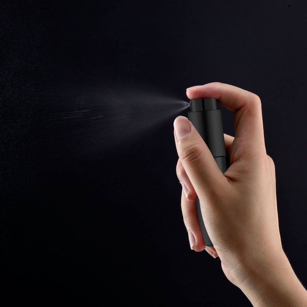 Lil Ray matte black twist-lid atomizer shows simple one-handed operation