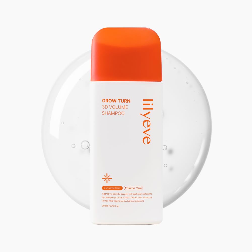 LilyEve GrowTurn bottle with built-in brush for deep scalp cleansing and even application.