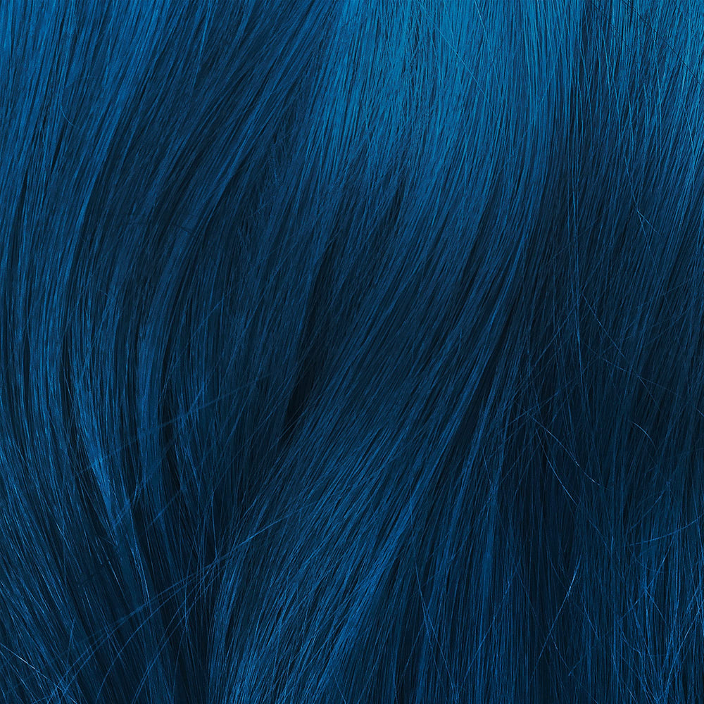 Dye being applied with a brush for smooth, even coverage.