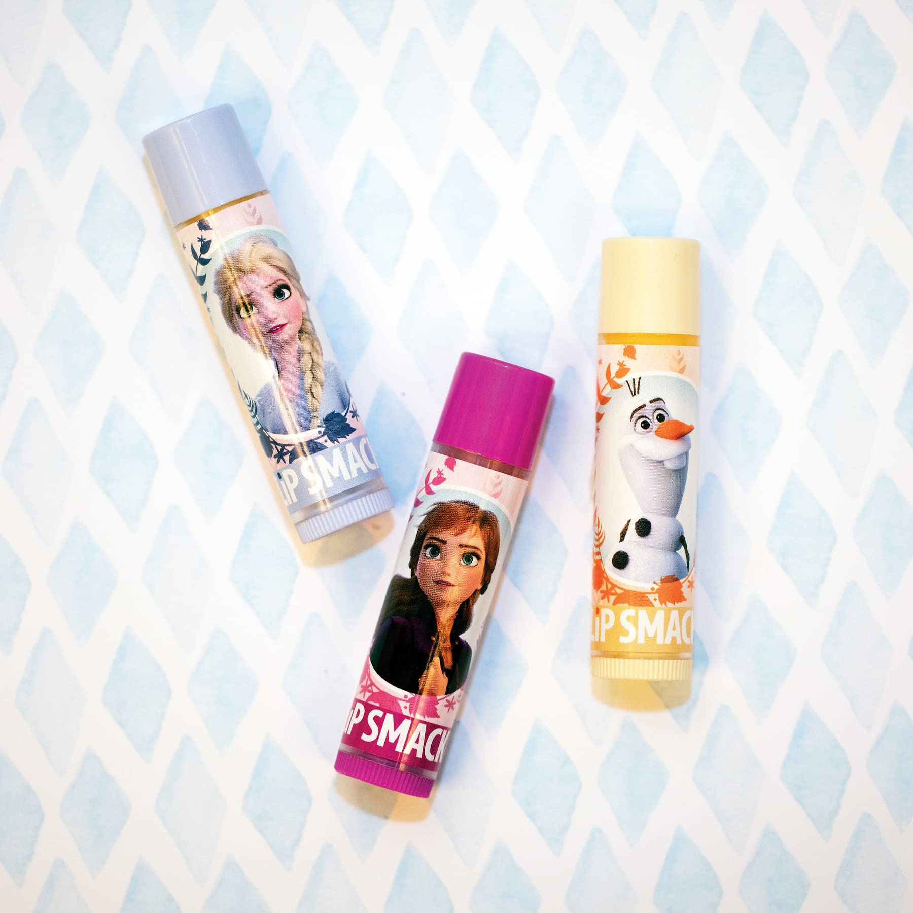 Lip Smacker Disney Frozen 2 Optimistic Berry balm delivers soft shine.