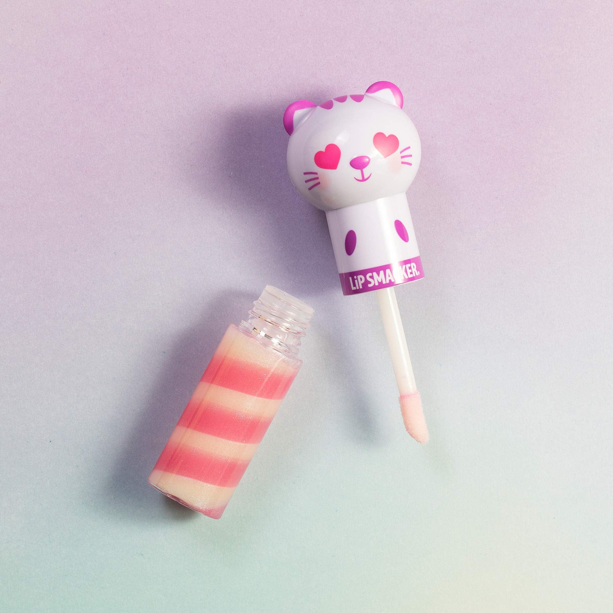 Application shot of Lip Smacker Kitty Kitten balm demonstrating easy glide