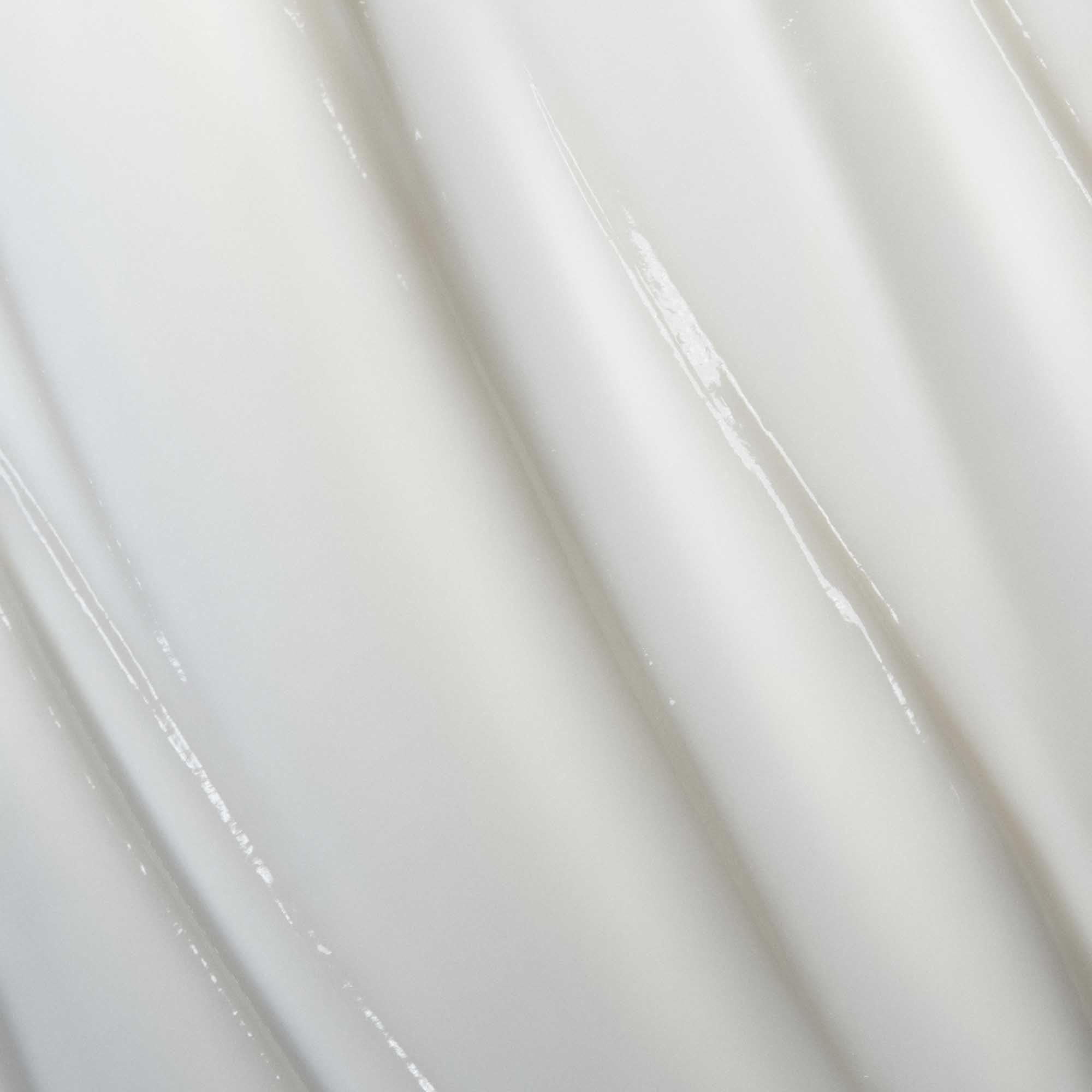 Living Proof Curl Conditioner hair-glide close-up demonstrating detangling that protects delicate curls.