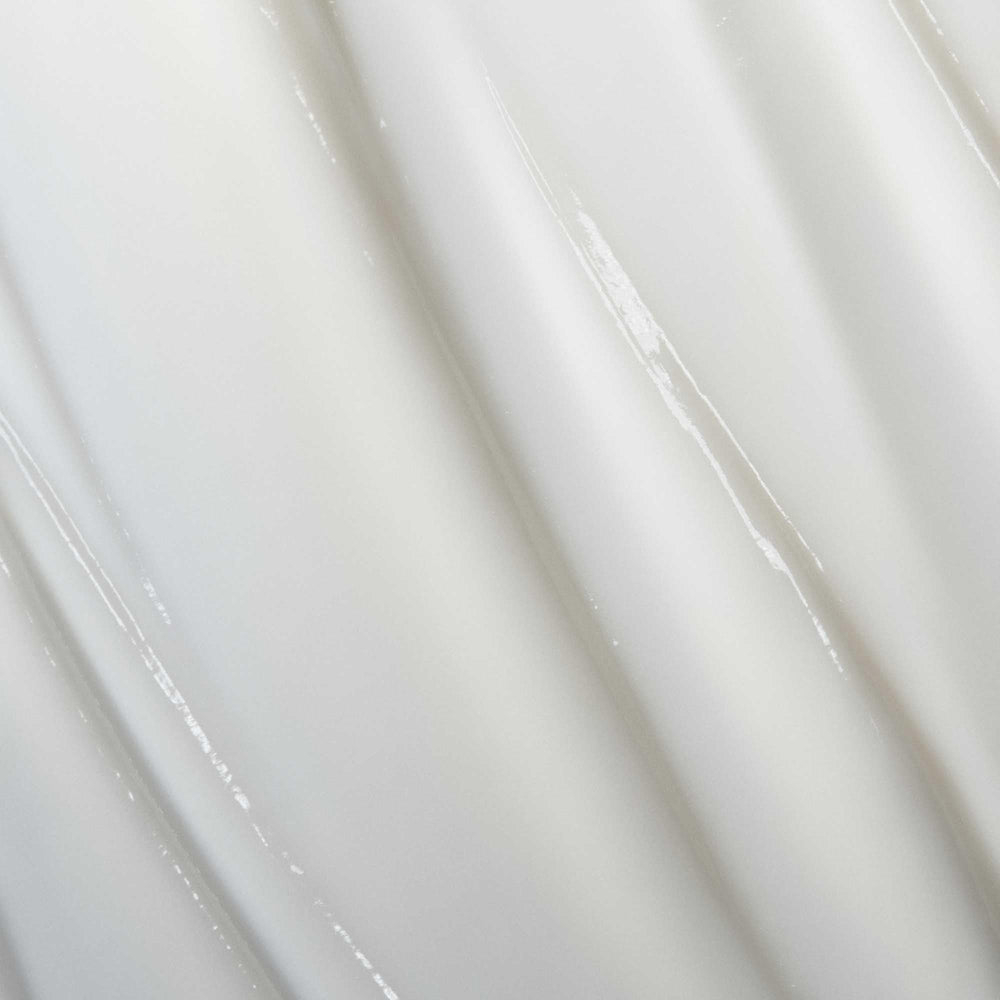 Living Proof Curl Conditioner hair-glide close-up demonstrating detangling that protects delicate curls.