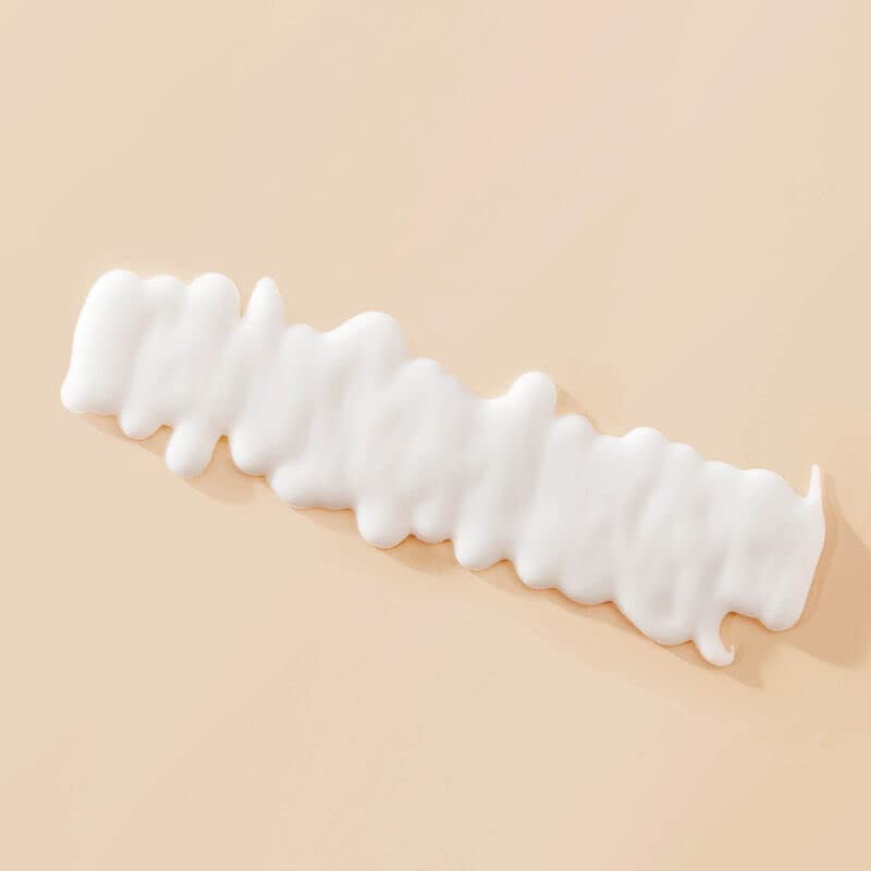 Living Proof Curl Definer closeup curls highlighting frizz-free springy definition.