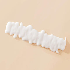 Living Proof Curl Definer closeup curls highlighting frizz-free springy definition.