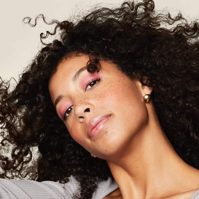 Living Proof Curl Definer texture shows silky conditioned curls with natural shine.