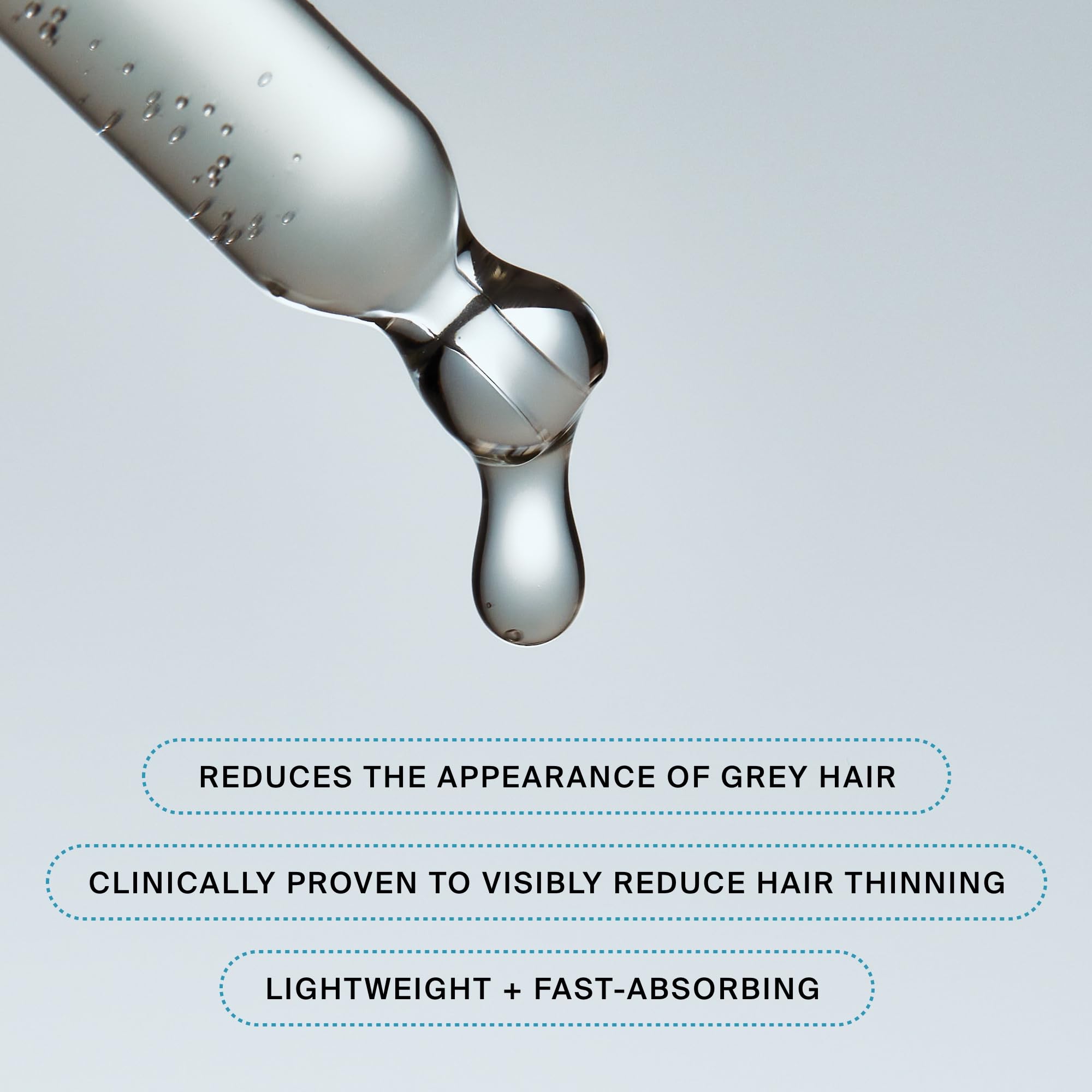 Living Proof Density Serum on hair strands close-up for potential density and shine