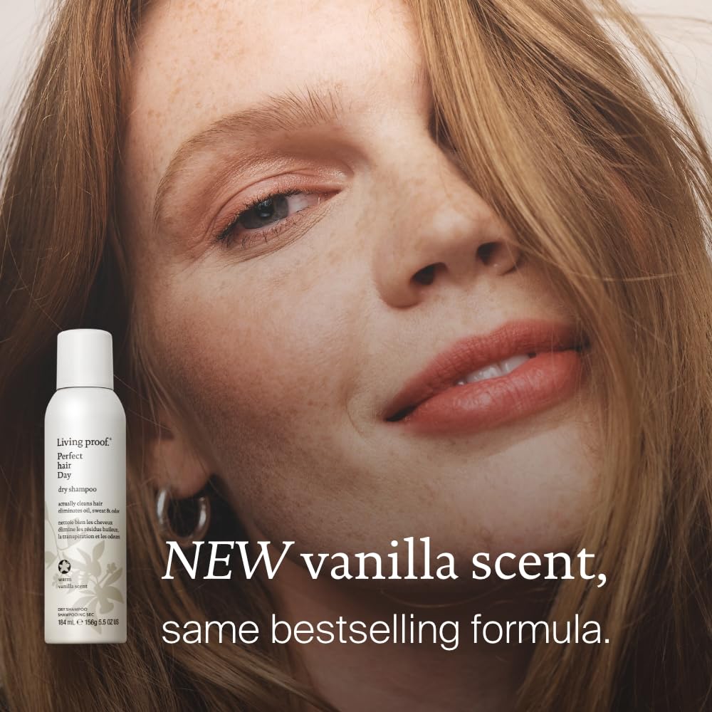 Applying Living Proof Dry Shampoo with vanilla scent for a reset.
