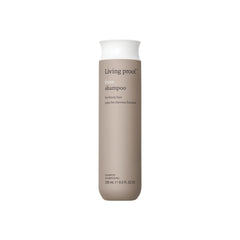 Living Proof No Frizz Shampoo bottle on shelf offers daily frizz control.