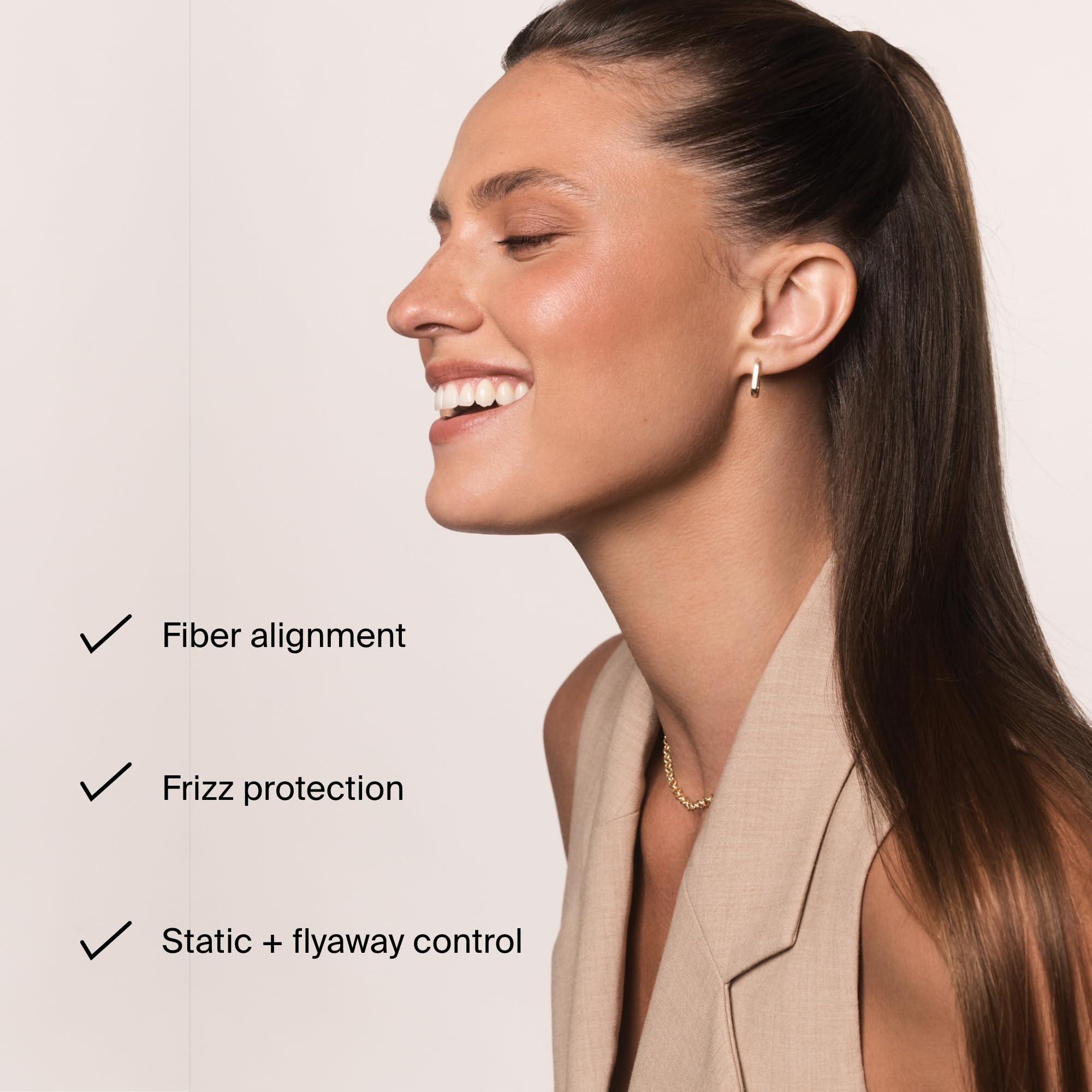 Hair close-up shows sleek frizz-free texture with Living Proof styling cream