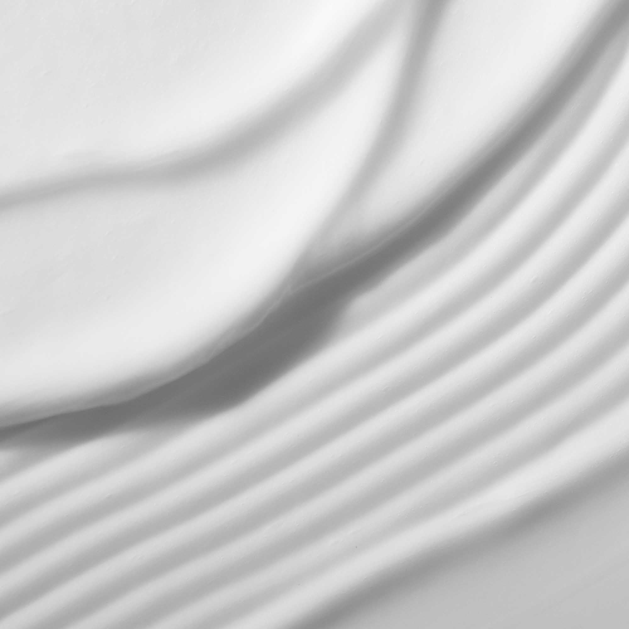 Living Proof Restore Conditioner after-use hair close-up reveals silky texture and manageability.