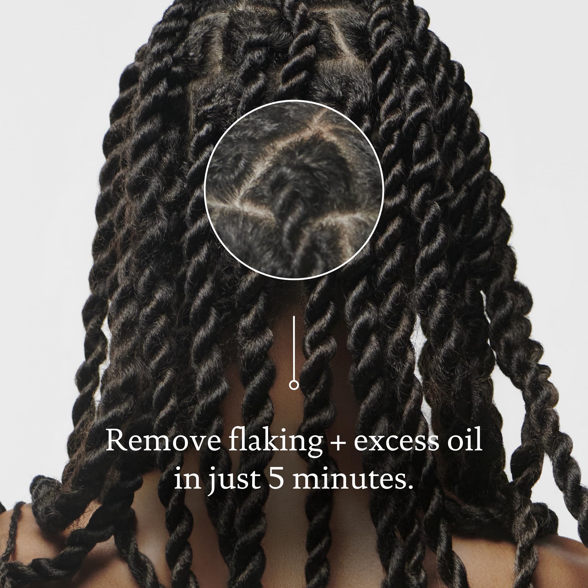 Living Proof Scalp Care Exfoliator serum close-up showing light, silky texture.