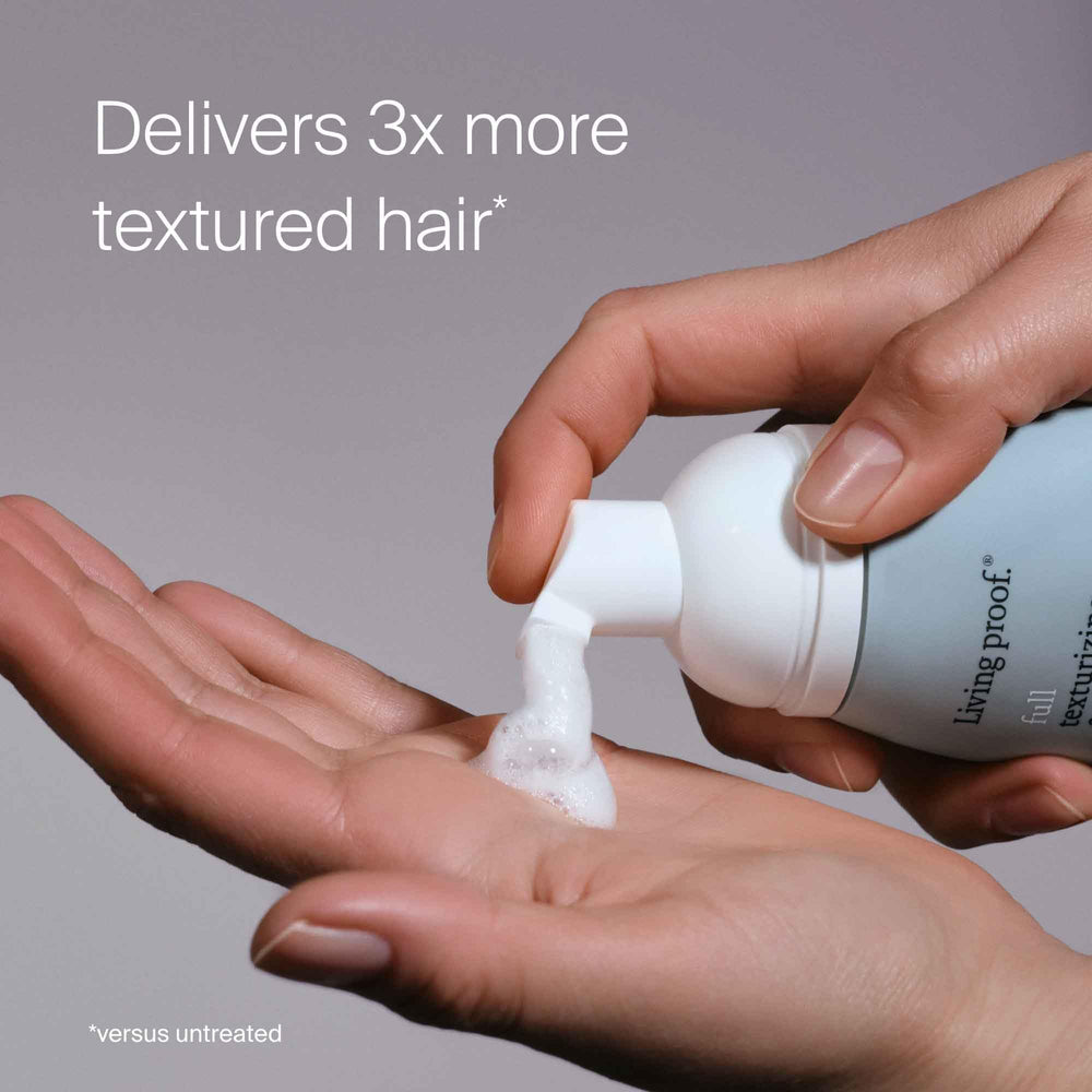 Dry hair being styled with Full Texturizing Foam to revive texture and lift.