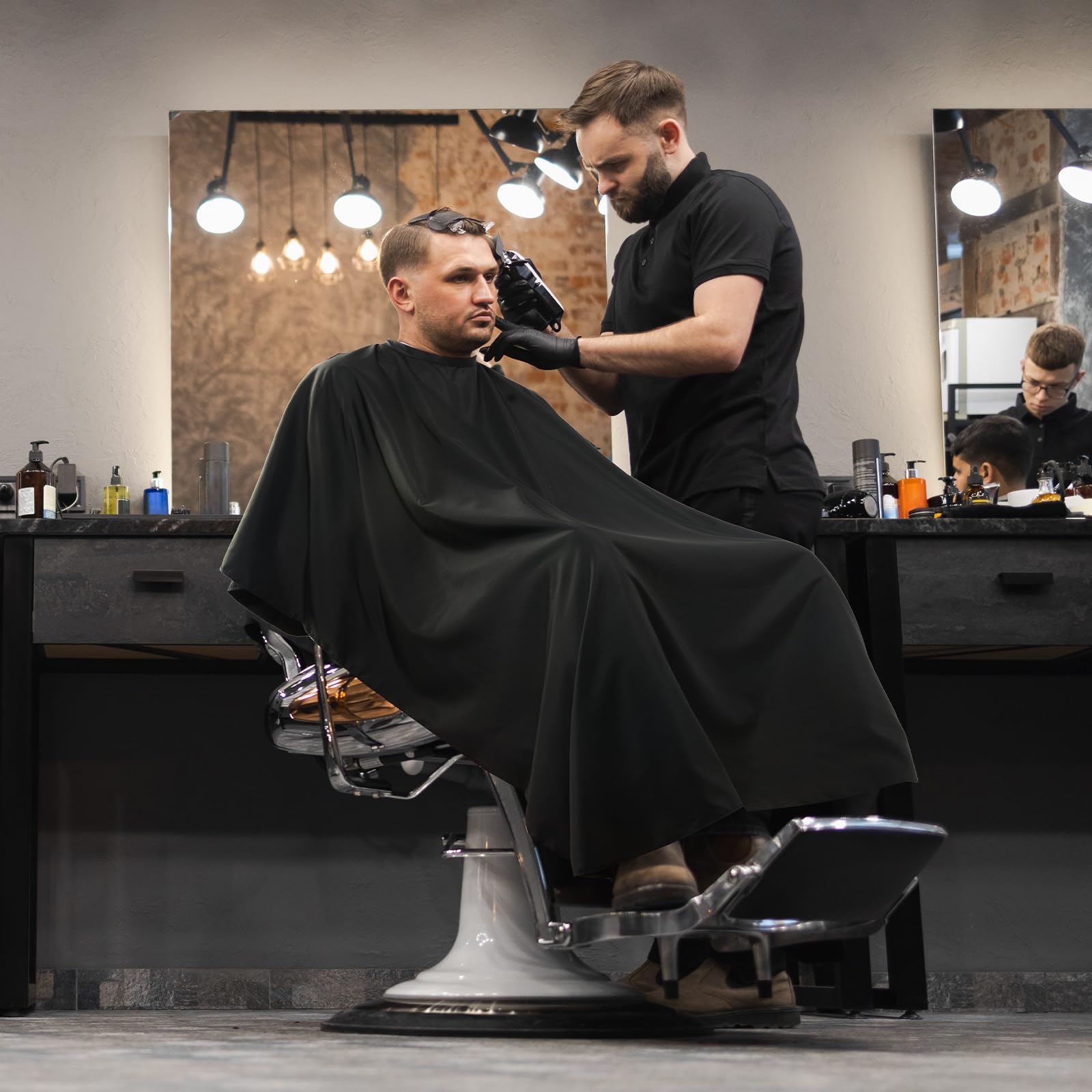 LLEZZA cape in use during haircut and coloring session