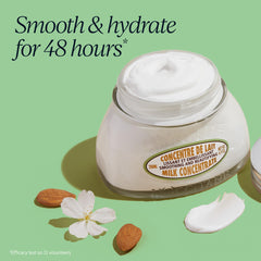 L'Occitane Almond Milk Concentrate cream texture close-up highlighting smoothing feel.