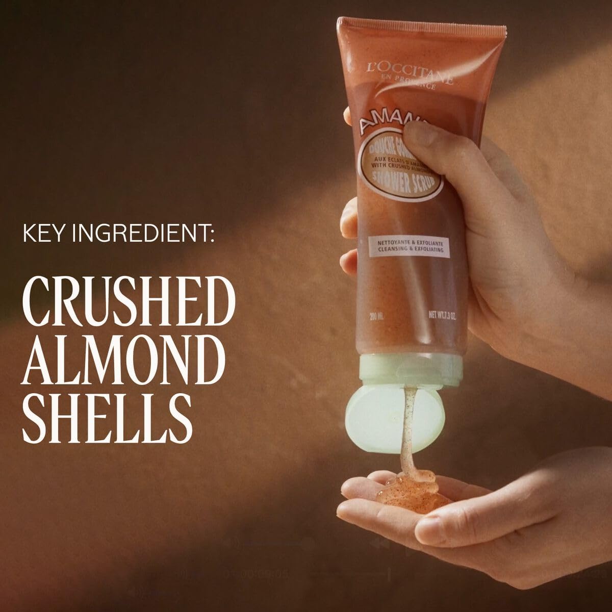 L'Occitane Almond Shower Scrub gel texture ready to cleanse.