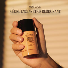 L'Occitane Eau des Baux stick deodorant in use shows smooth application.