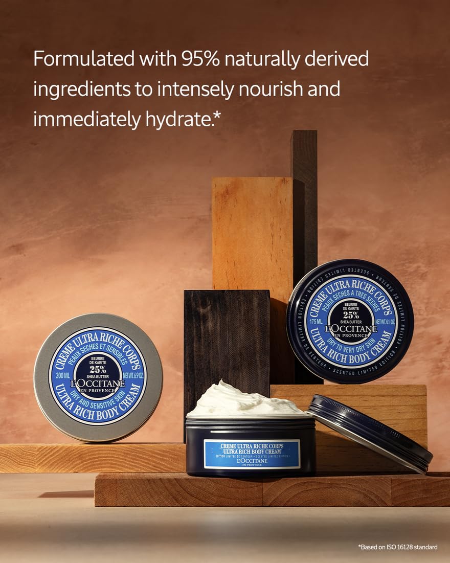 Loccitane body cream on bathroom shelf with towels nearby