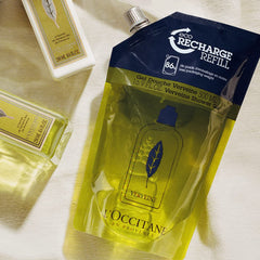 L'Occitane Verbena Shower Gel being poured releases rich foam for gentle cleansing.