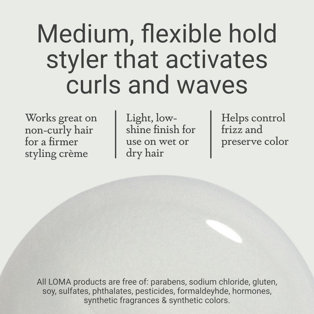 Applying Curvy Crème on hair demonstrates medium hold for curls