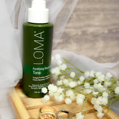 Loma Fortifying Reparative Tonic dispensing action shows even distribution and finish.