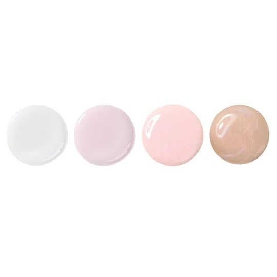 LONDONTOWN Illuminating Nail Concealer collection displayed on a vanity shelf.