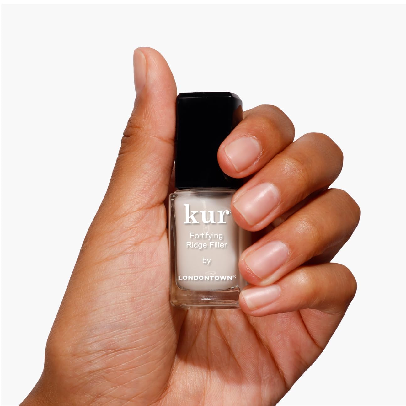 LONDONTOWN Kur Nail Ridge Filler brush application on nails for even coverage