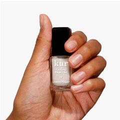 LONDONTOWN Kur Nail Ridge Filler brush application on nails for even coverage
