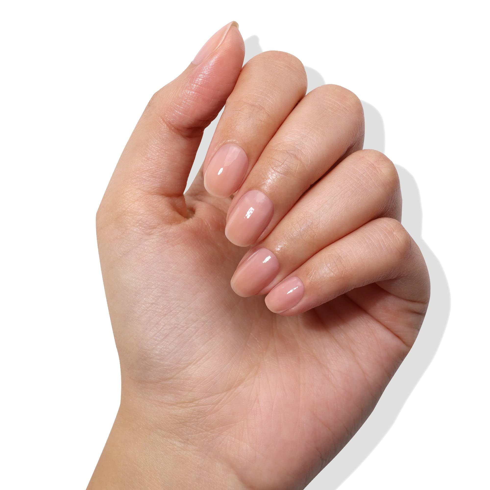Closeup of the Londontown Nail Veil brush applying dusty rose tint.