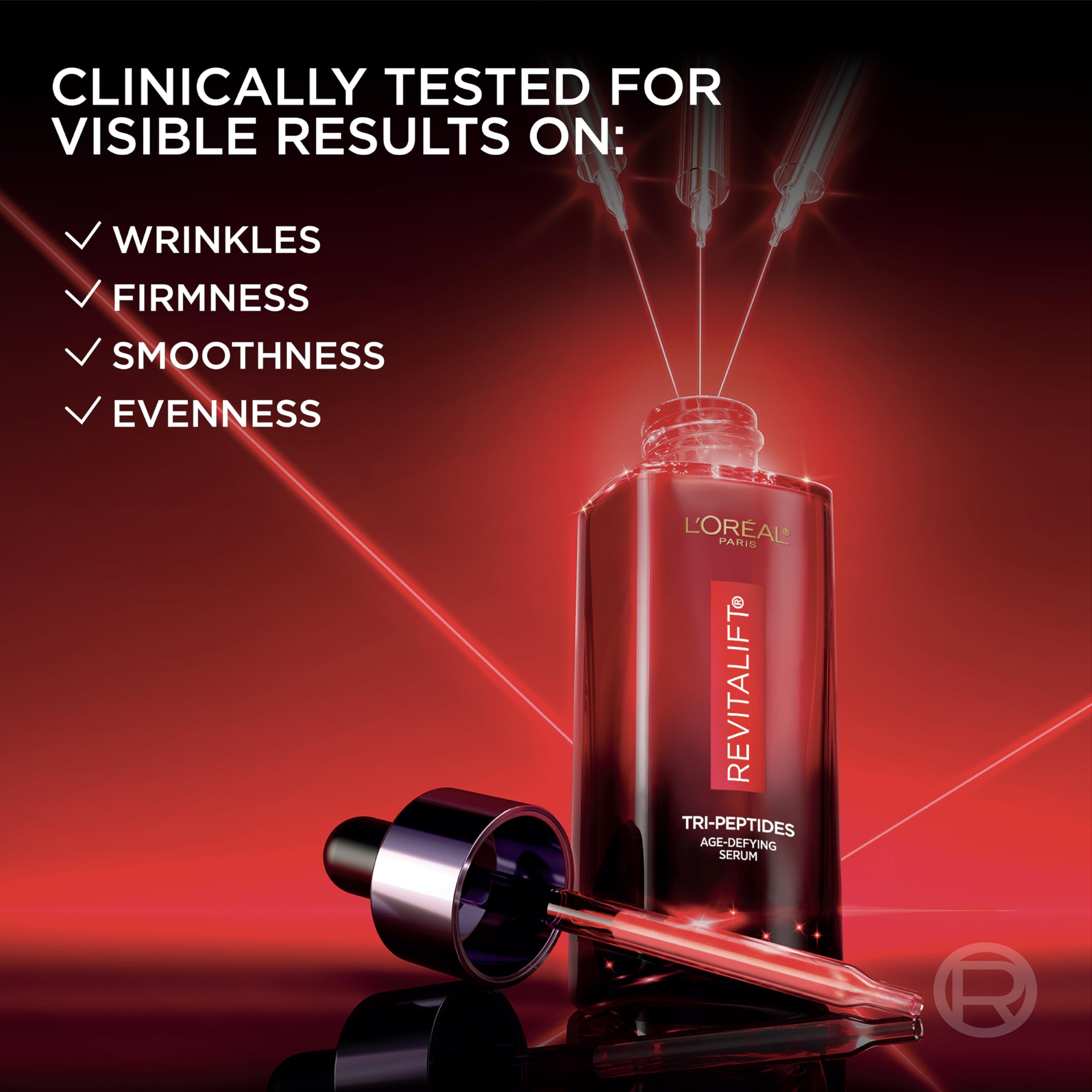 L'Oreal Paris Revitalift triple power serum on skin ready to glow.