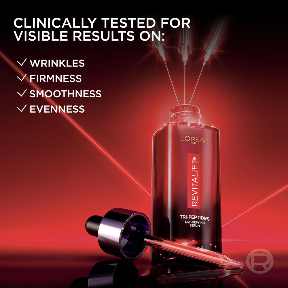 L'Oreal Paris Revitalift triple power serum on skin ready to glow.