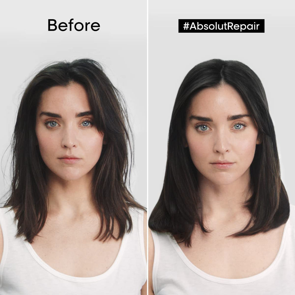 Hands applying Absolut Repair Golden Mask to hair for deep conditioning